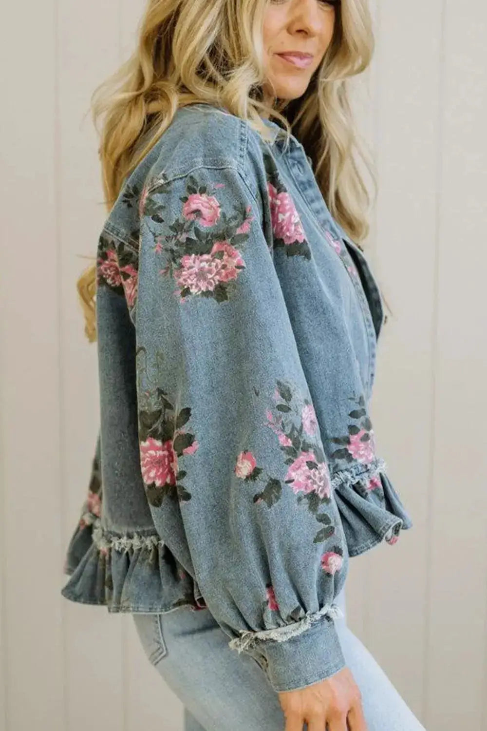 Women blue denim jacket with pink floral print and delicate ruffled hem