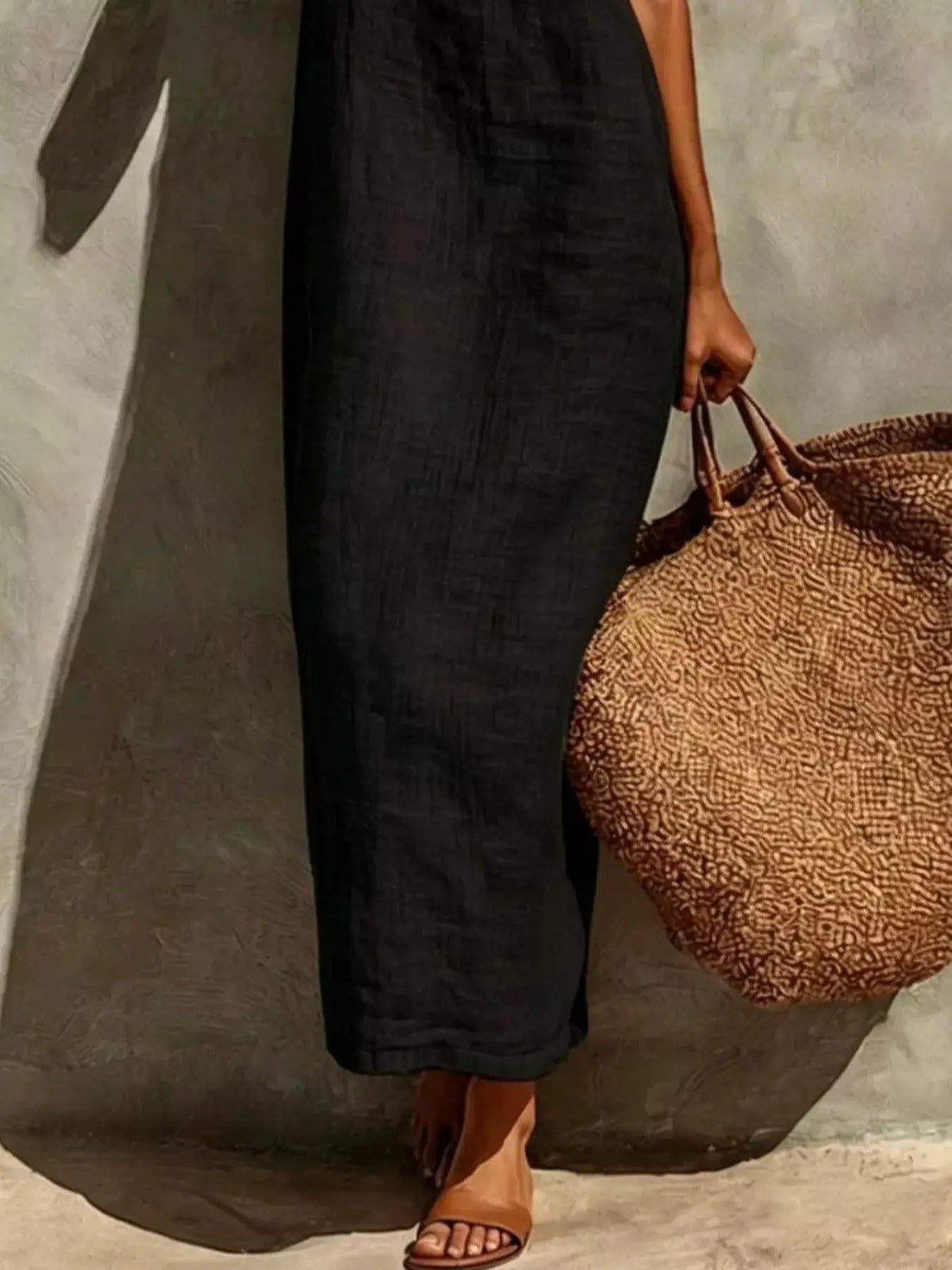 Sleeveless Linen Casual Maxi Dress in black, paired with a brown patterned tote bag