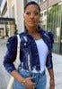 Short distressed denim trucker jacket for women in blue.