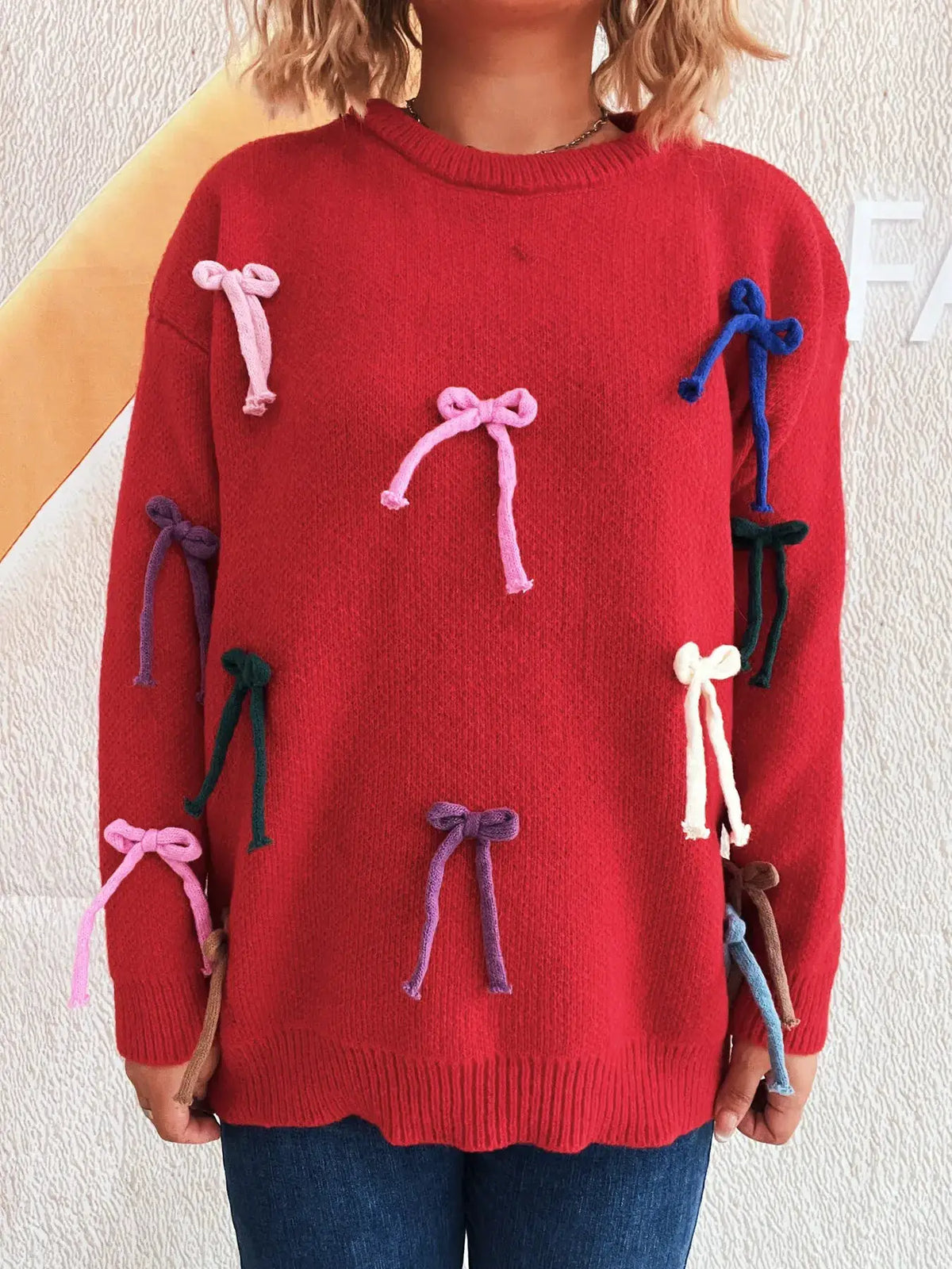Vibrant red bow-accent knit sweater with multicolored bows, Trendsi round-neck pullover for women