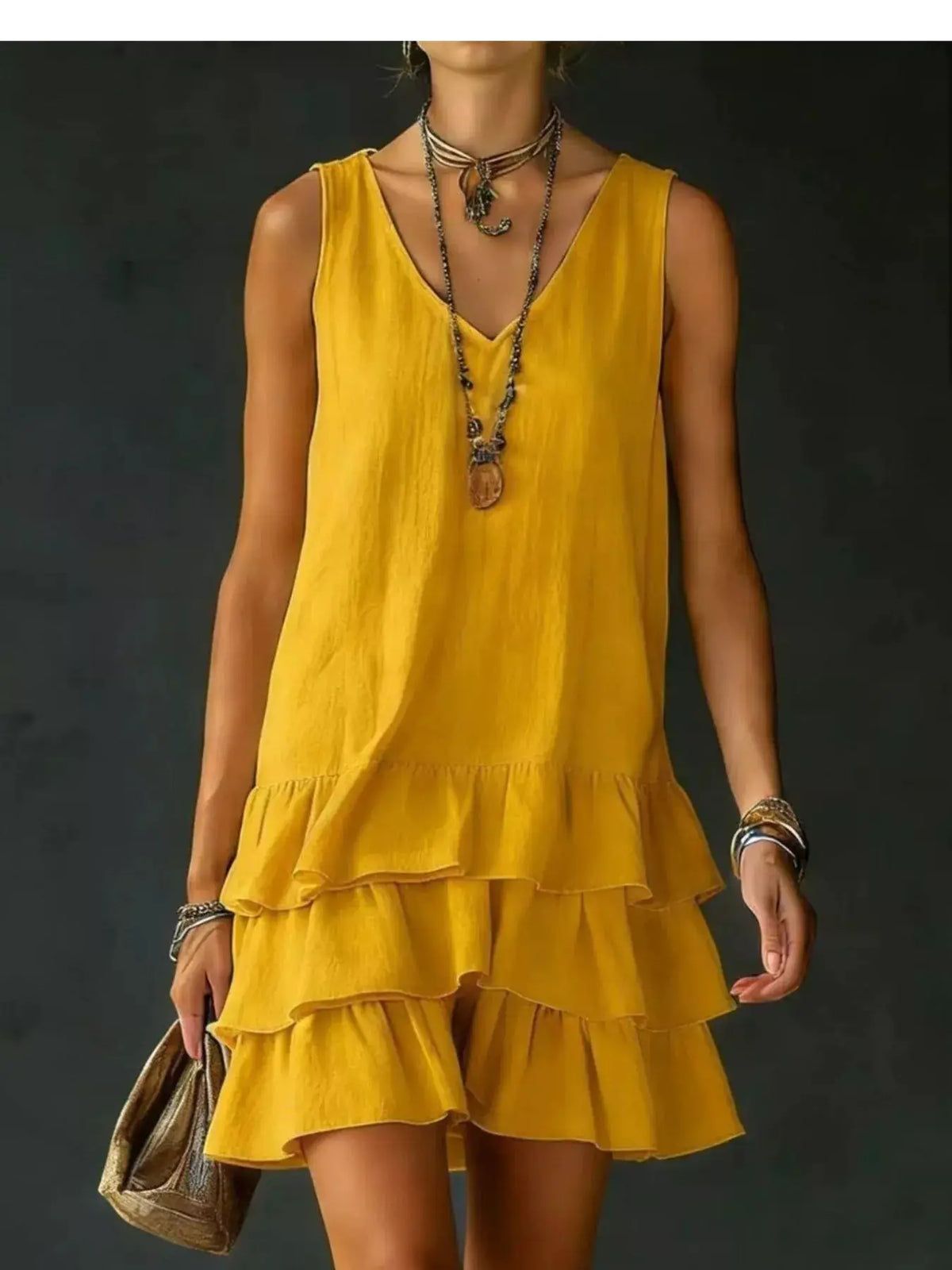 Trendsi plus-size V-neck sleeveless dress in mustard yellow with a layered ruffled hem.
