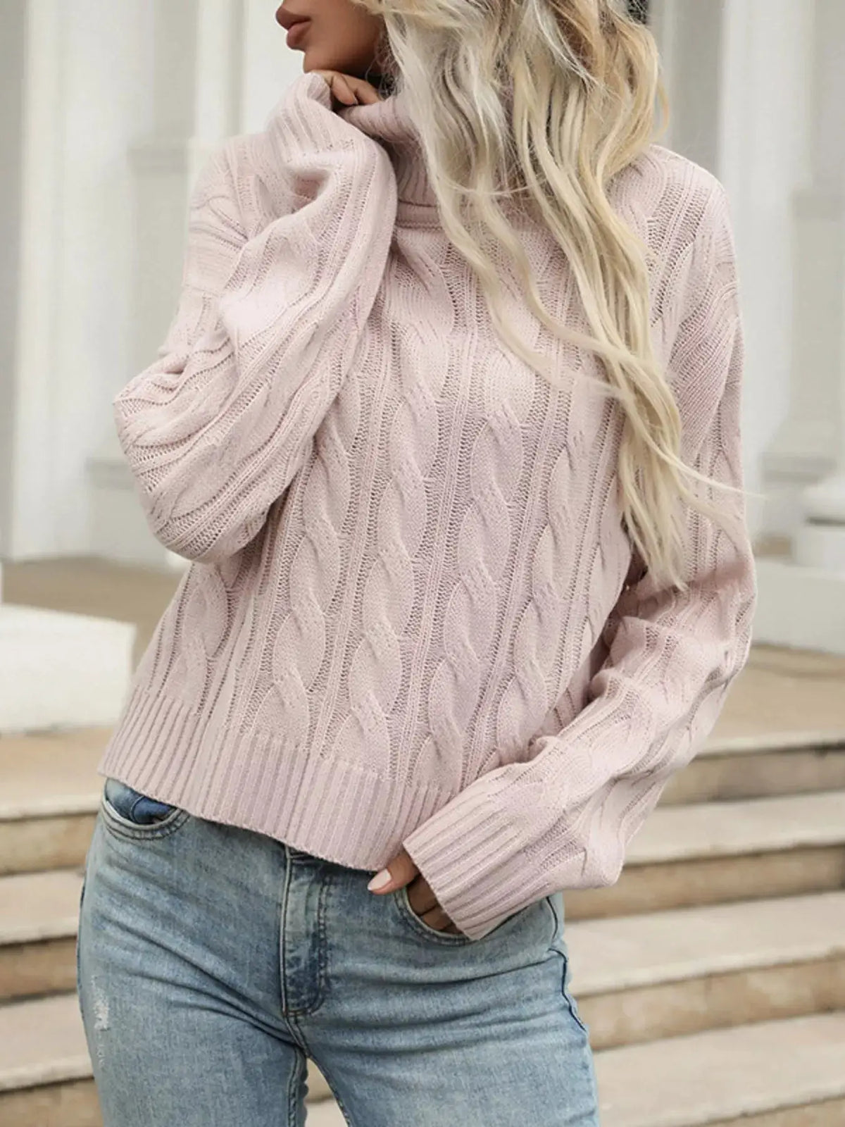 Cozy cable-knit turtleneck sweater in pale pink, soft stretchy pullover