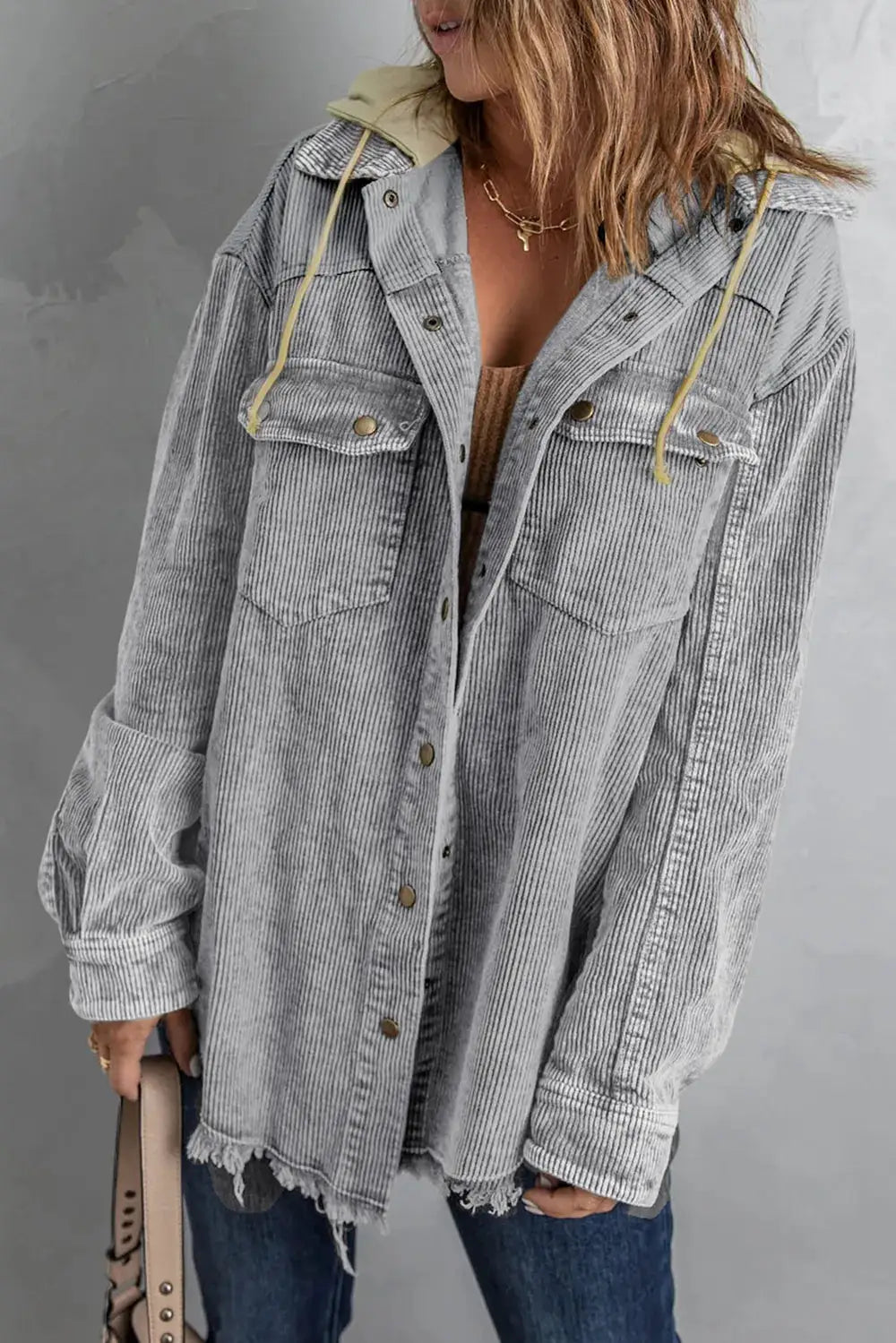 Snap Front Hooded Corduroy Shacket in light gray with chest pockets and frayed hem.