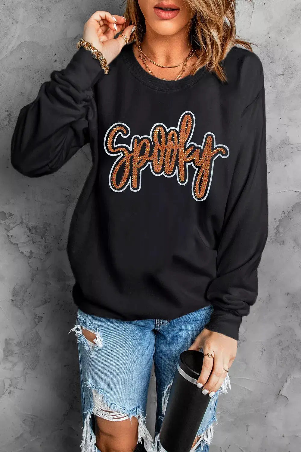 Spooky Rhinestone Drop Shoulder Sweatshirt by Trendsi, black oversized sweatshirt with orange rhinestone script