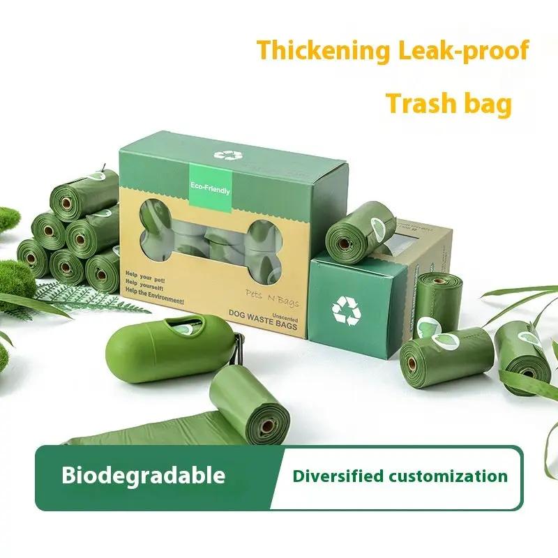 AdTec biodegradable pet waste bags in green rolls with a dispenser and eco-friendly packaging