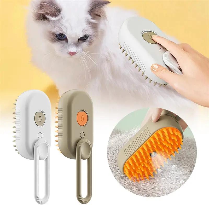3-in-1 electric cat grooming steam brush set; two white and beige handheld brushes with orange button