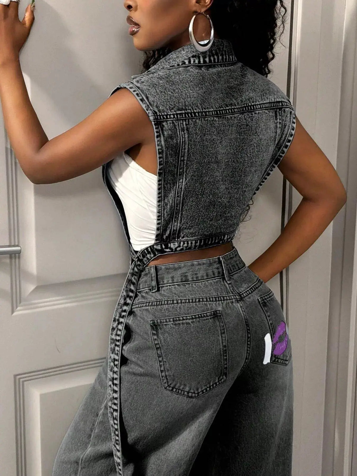 Open-front high-low denim vest with vintage wash and pockets