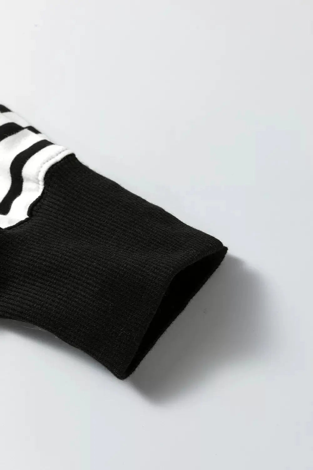Color Block Striped Cotton Blend Long Sleeve Sweatshirt cuff with black ribbed edge and white stripes