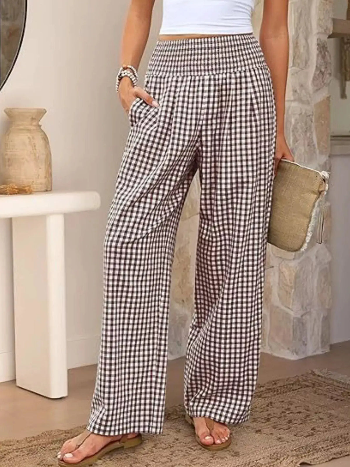 Gingham wide-leg pants in black-and-white checks with pockets, styled with a white top.