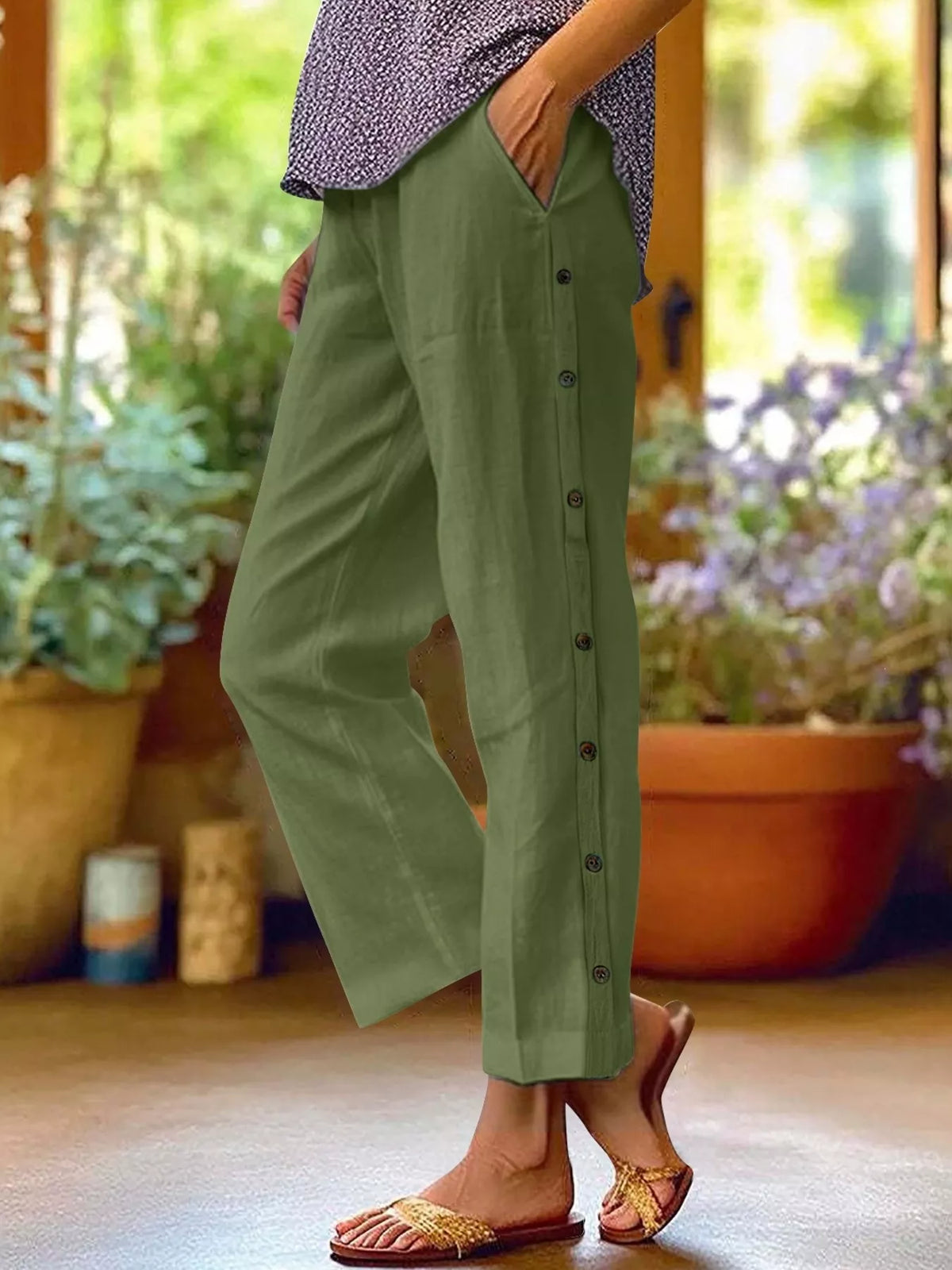 Plus-size olive green pants with side-button decor and pockets