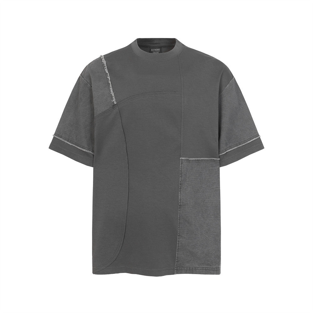 Irregular color-blocked fringed short-sleeve T-shirt by eprolo; charcoal gray patchwork with exposed seams.