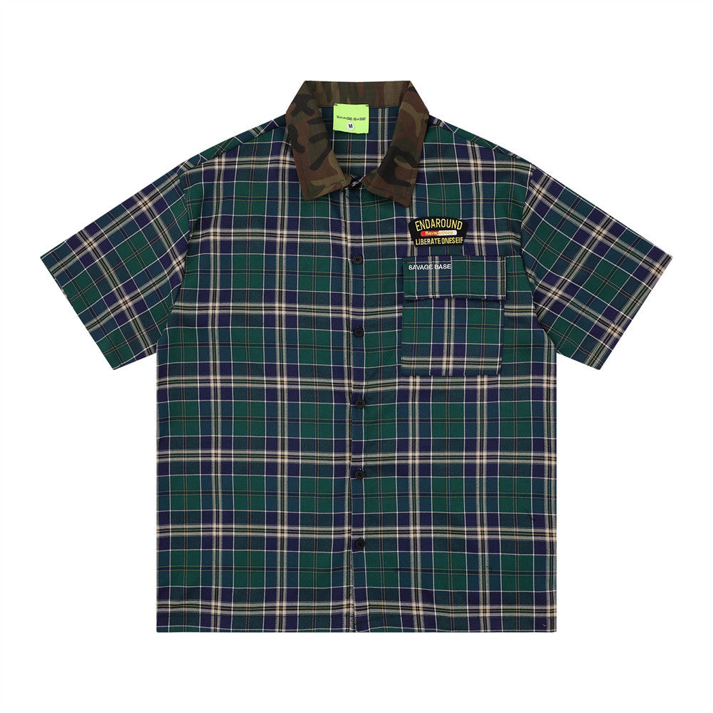 Loose plaid short-sleeve shirt by eprolo in green/blue plaid with camo collar and chest patches.