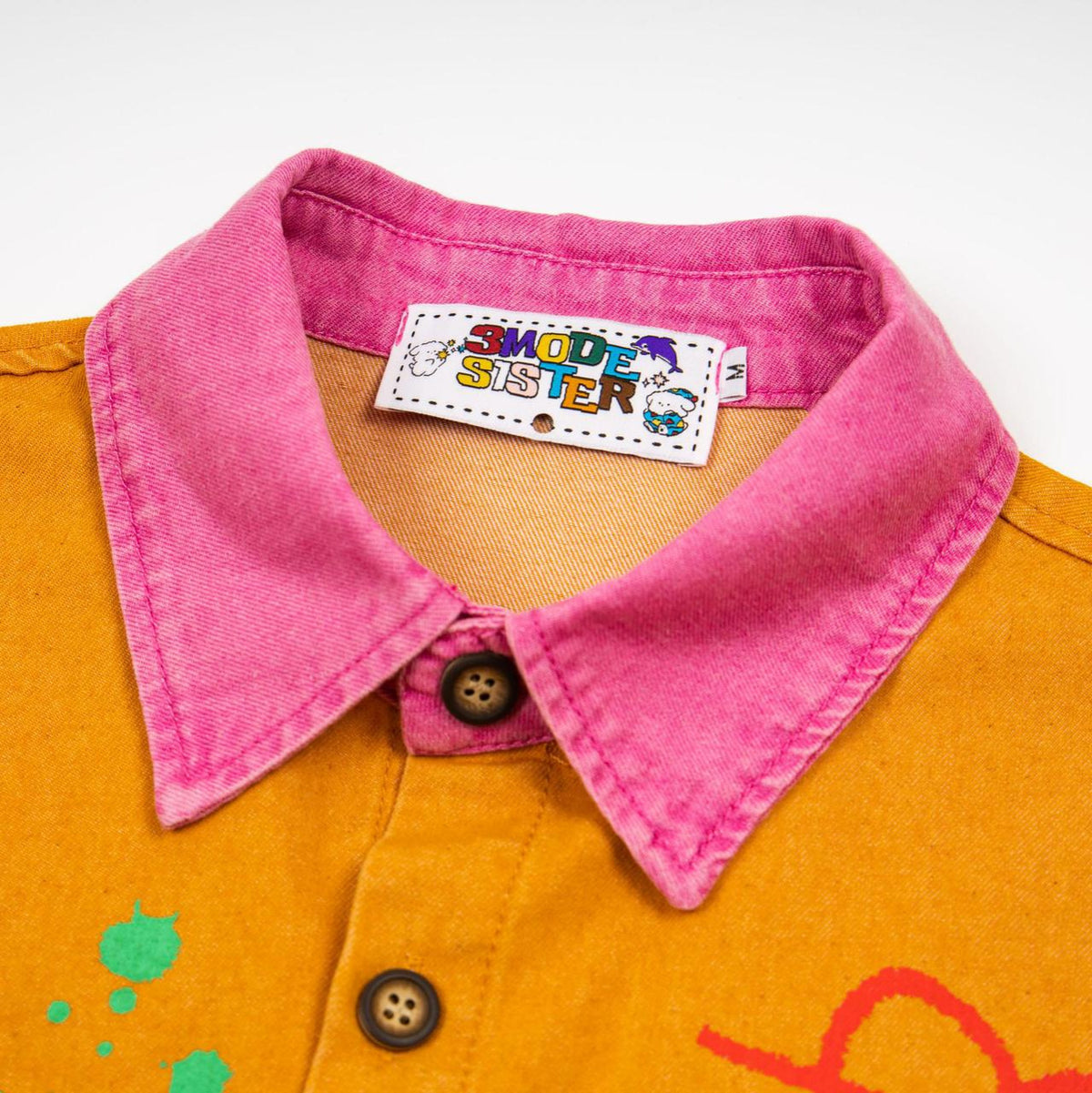 Short-sleeve embroidered shirt by 3MODE SISTER with pink collar and orange body patchwork