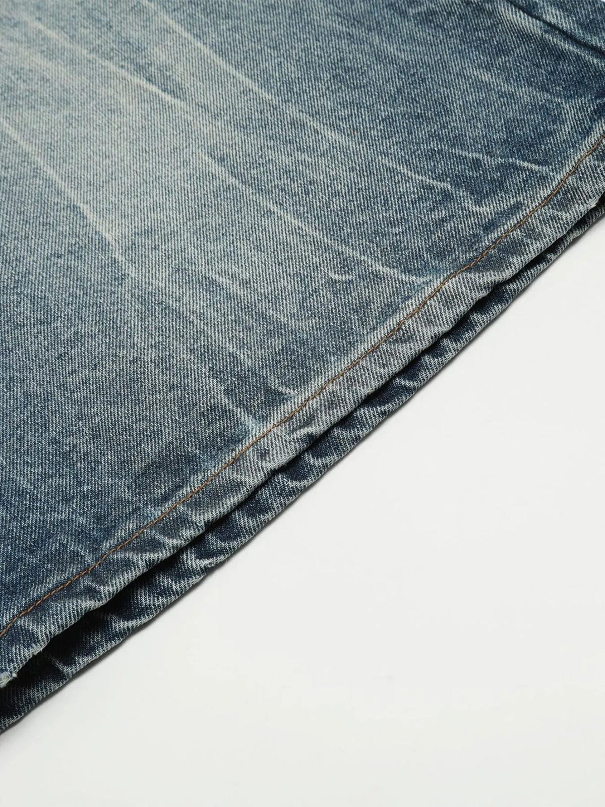 Mens washed light-blue denim shorts with visible orange stitching along the hem.