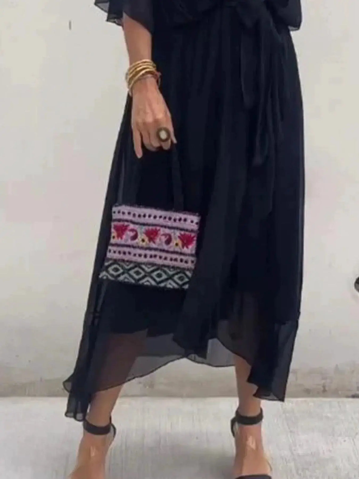 Plus size black flowy tie-front midi dress with flutter sleeves
