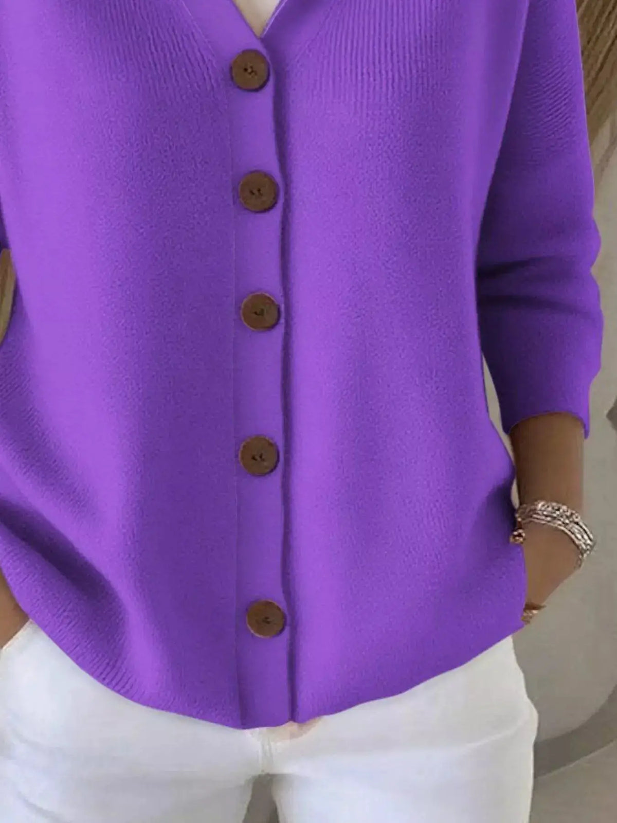 Plus-size purple knit cardigan with button-front by Trendsi; soft knit fabric and brown buttons.