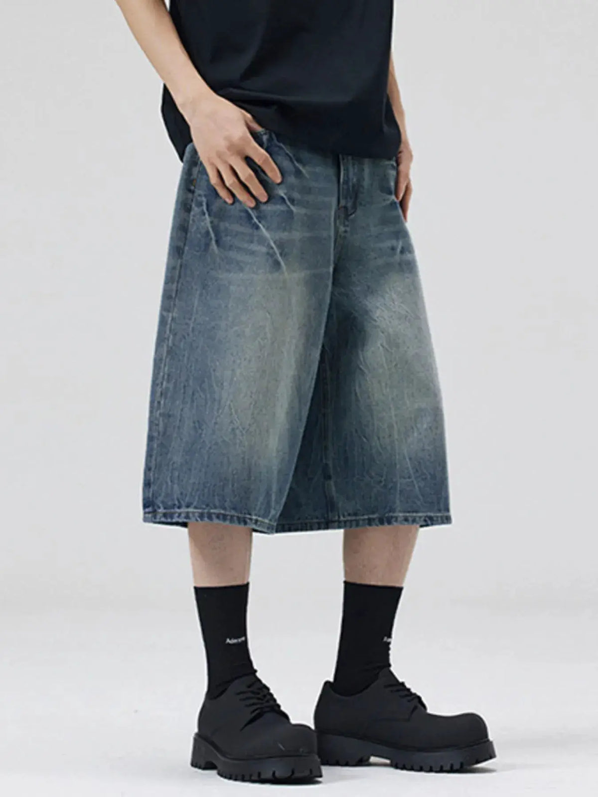 Men's oversized wide-leg distressed denim shorts in faded wash