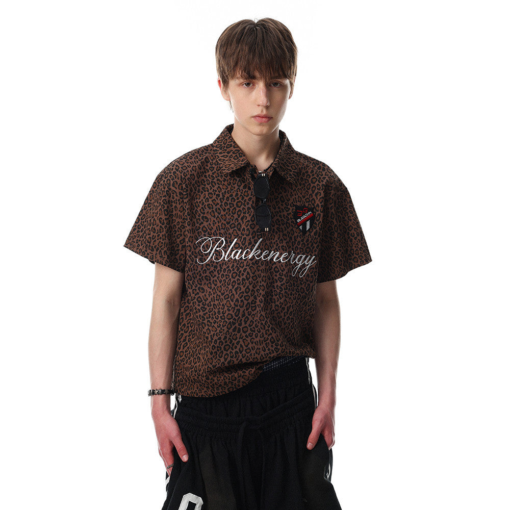 Leopard-print short-sleeve polo shirt by eprolo in brown with black spots, worn by a model.