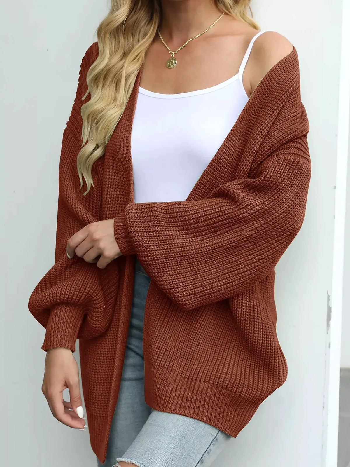 Cozy oversized chunky knit open-front cardigan in rust with lantern sleeves