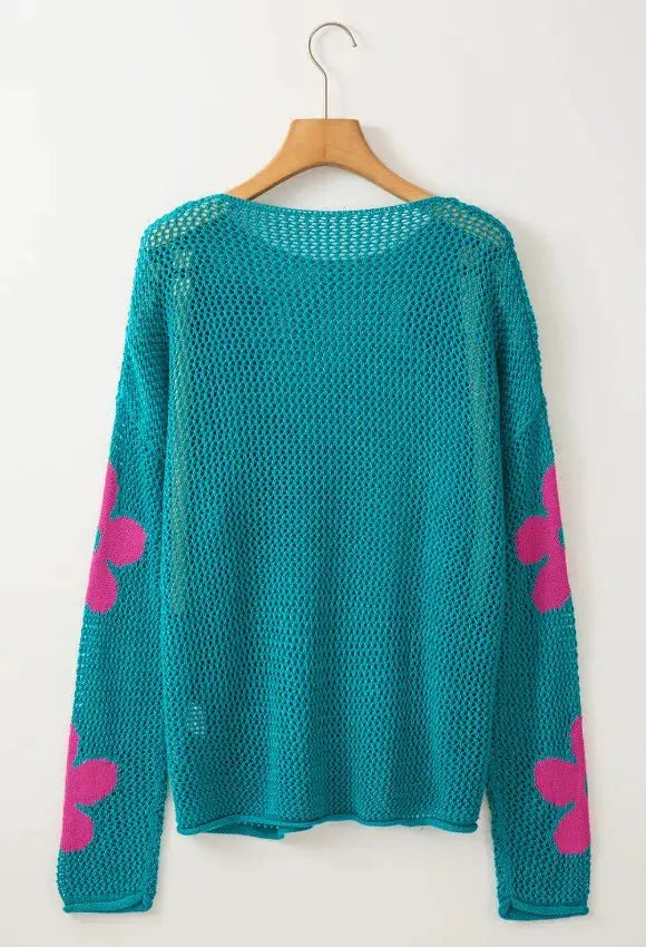 Lightweight openwork floral knit cover up by Trendsi, teal with pink floral patches on sleeves, round neck.