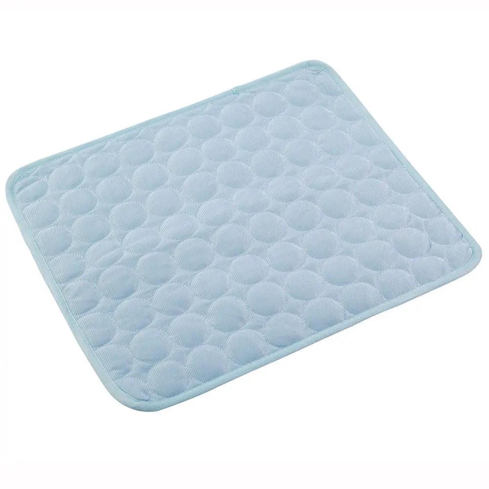 Dog cooling mat in light blue with quilted circular pattern, extra large for dogs and cats.