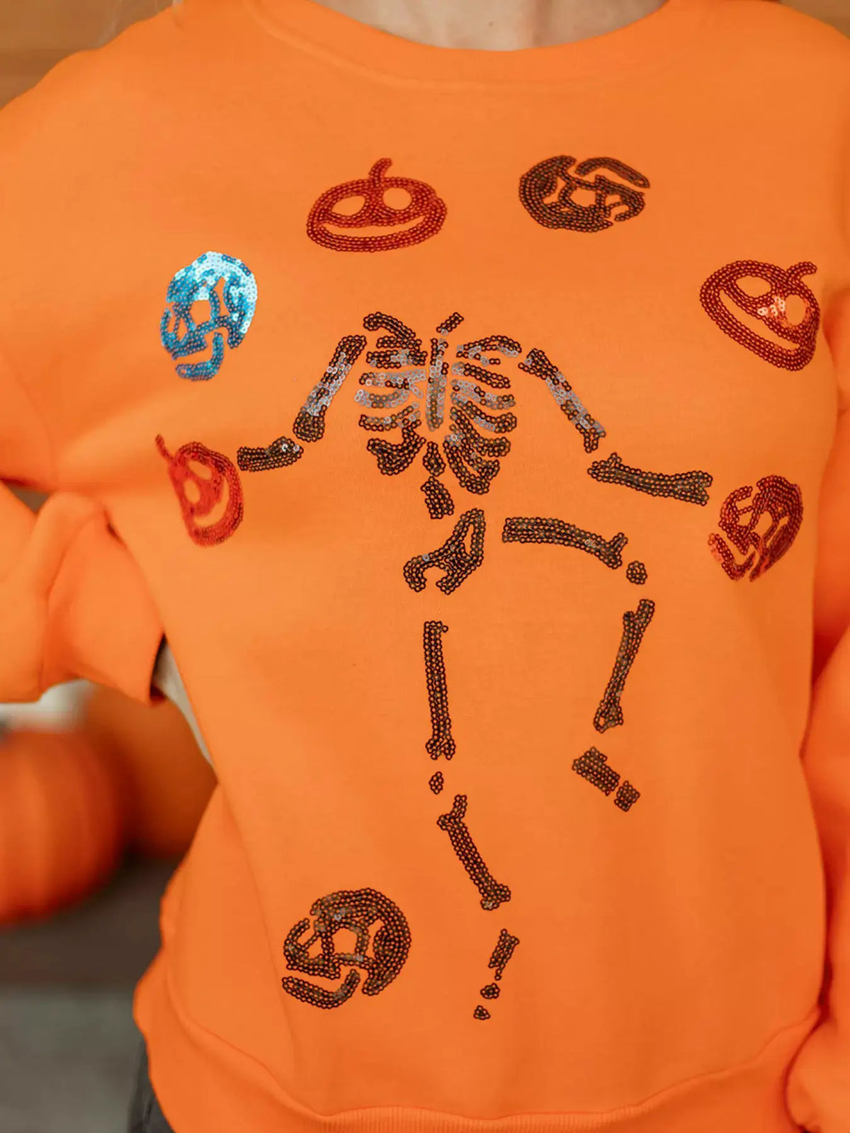 Dancing Critters Sequin Halloween Crewneck Sweatshirt in orange with skeleton and pumpkin sequin artwork