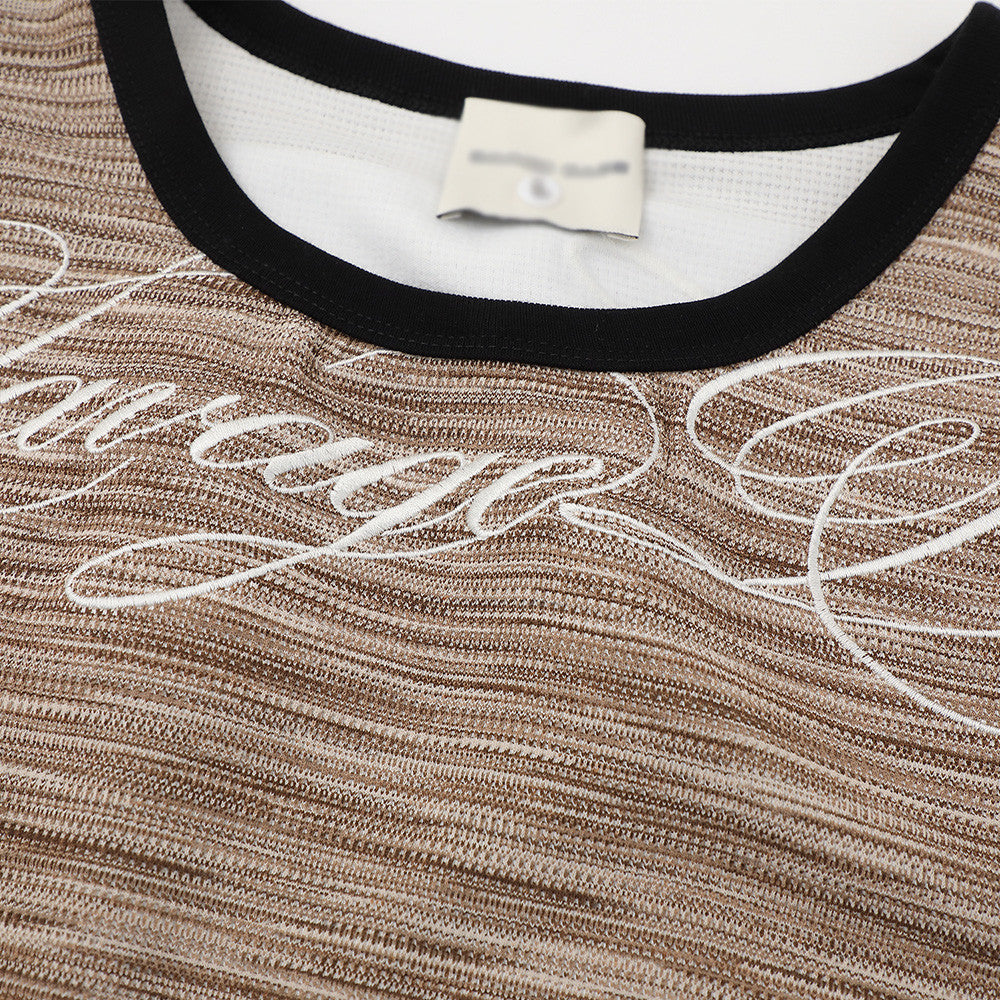 Color woven striped sports vest in brown tones with black trim and white script lettering.