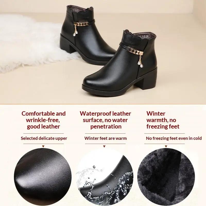 AdTec black leather ankle boots with gold-tone chain embellishment and chunky heel
