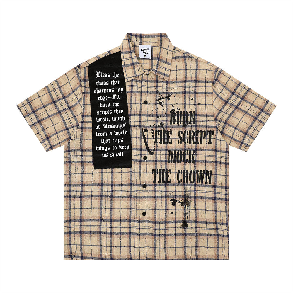 Beige plaid short-sleeve shirt with black script text print and paint splatters