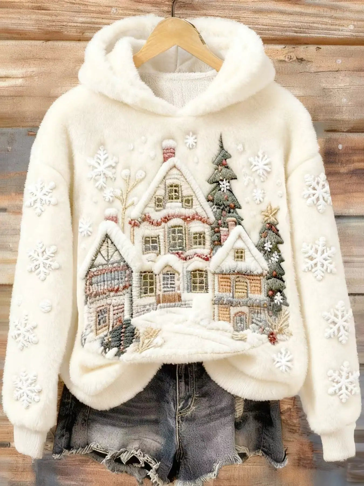 Womens cream Christmas hoodie with village applique and snowflakes on sleeves