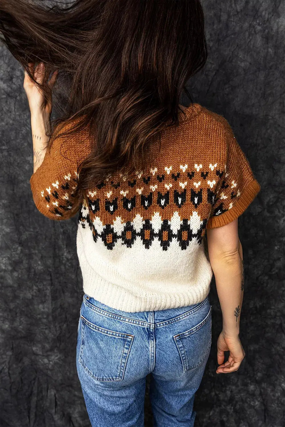 V-neck short-sleeve knitted geometric sweater in brown, ivory, and black colorblock.