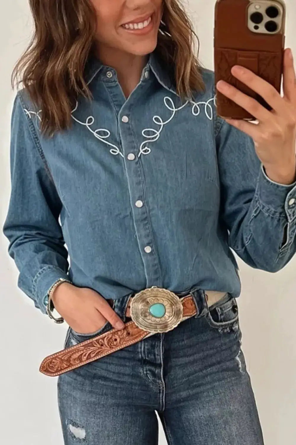 Embroidered Western denim top for women in blue with white looping embroidery and silver snaps