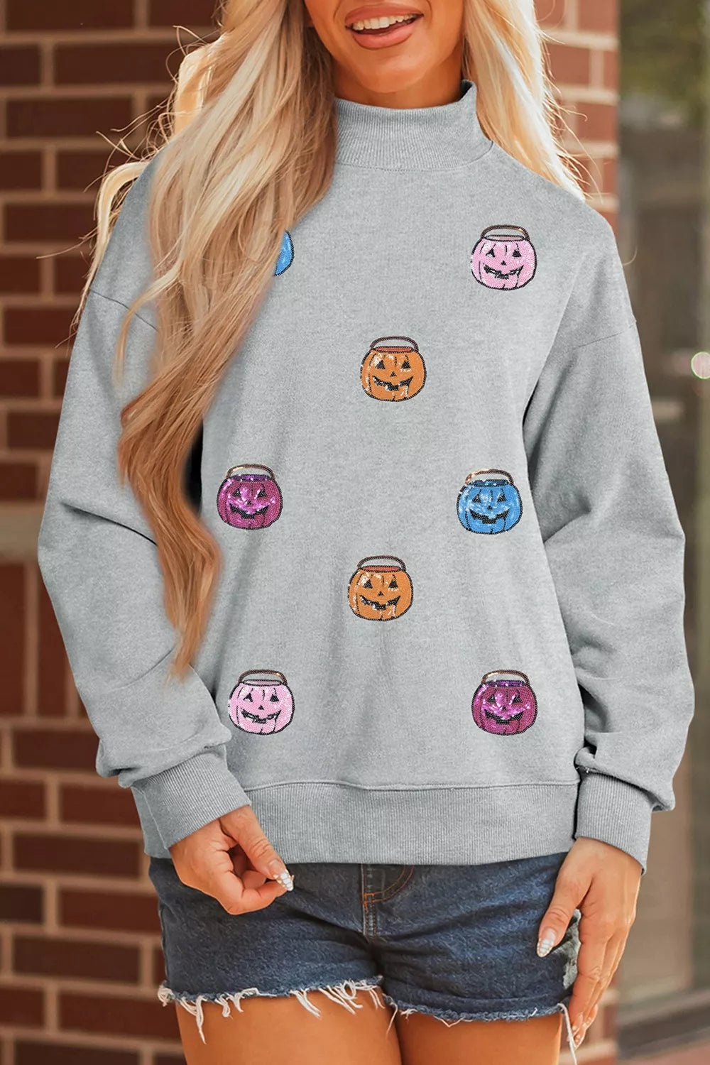 Halloween Pumpkin Long Sleeve Sweatshirt, gray with colorful jack-o'-lantern prints.