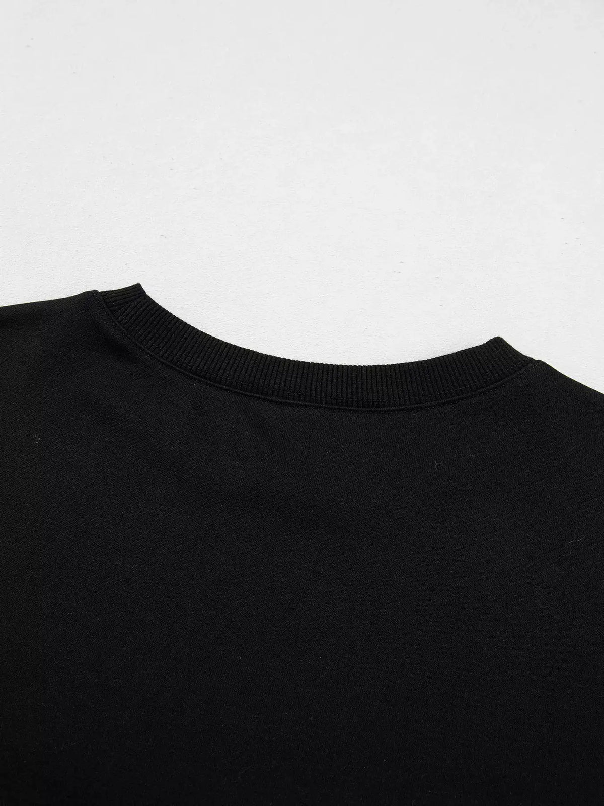 Embroidered Spooky Season long-sleeve sweatshirt, black crew-neck neckline close-up