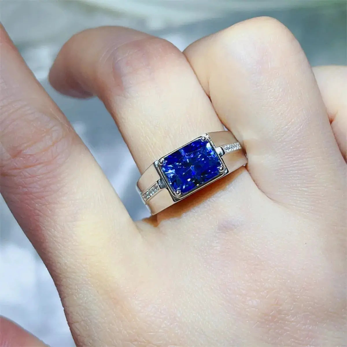 2 Carat Moissanite 925 Sterling Silver Ring with a blue square-cut center stone and pavé accents.