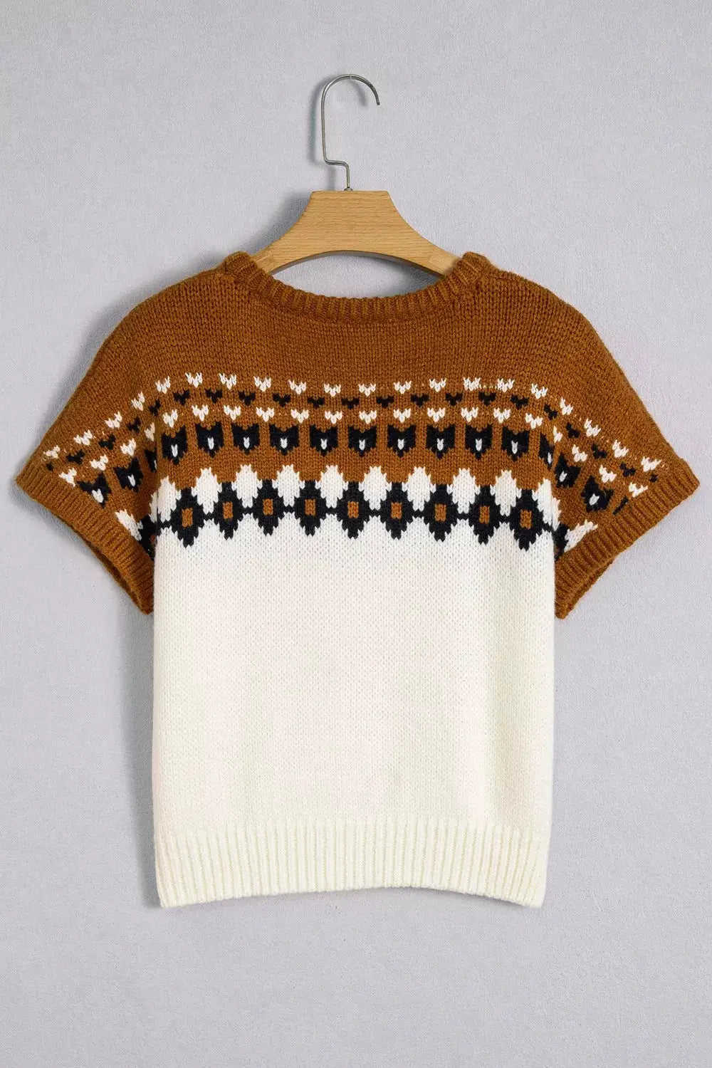 V-neck short-sleeve geometric knit sweater in tan and ivory with a black-and-white patterned band.