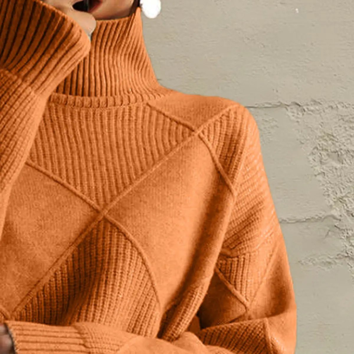 Geometric turtleneck long-sleeve sweater in burnt orange diamond-knit stretch knit