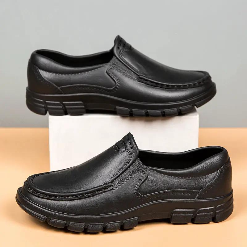 Pair of Velora men's slip-on leather flats, black with chunky rubber soles