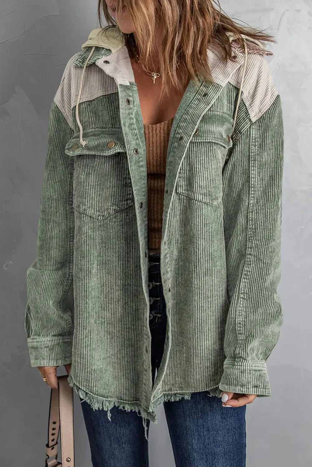 Snap Front Hooded Corduroy Shacket in sage green with frayed hem and chest pockets