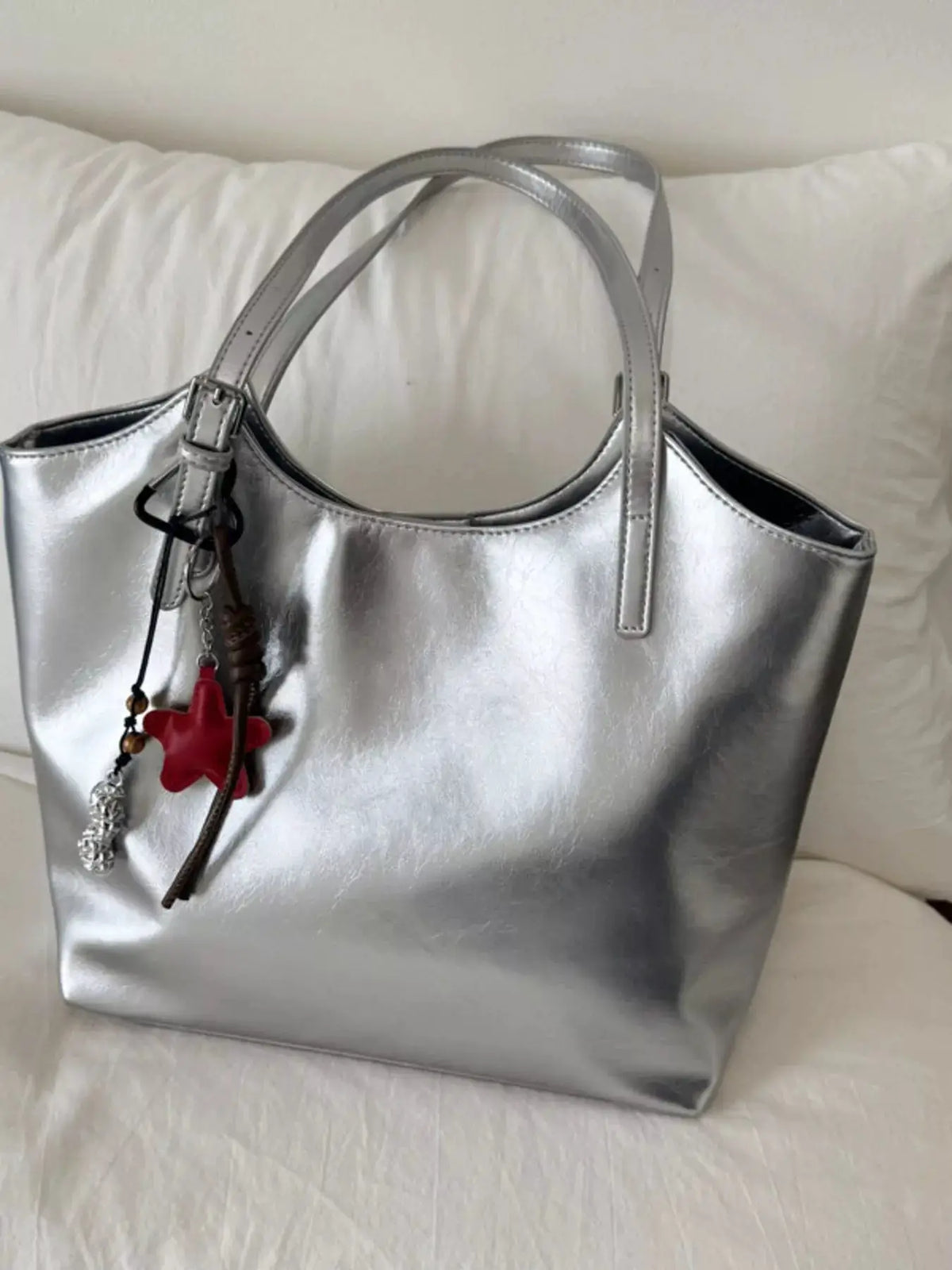 PU Leather Shoulder Bag in metallic silver with twin handles and charm attachments