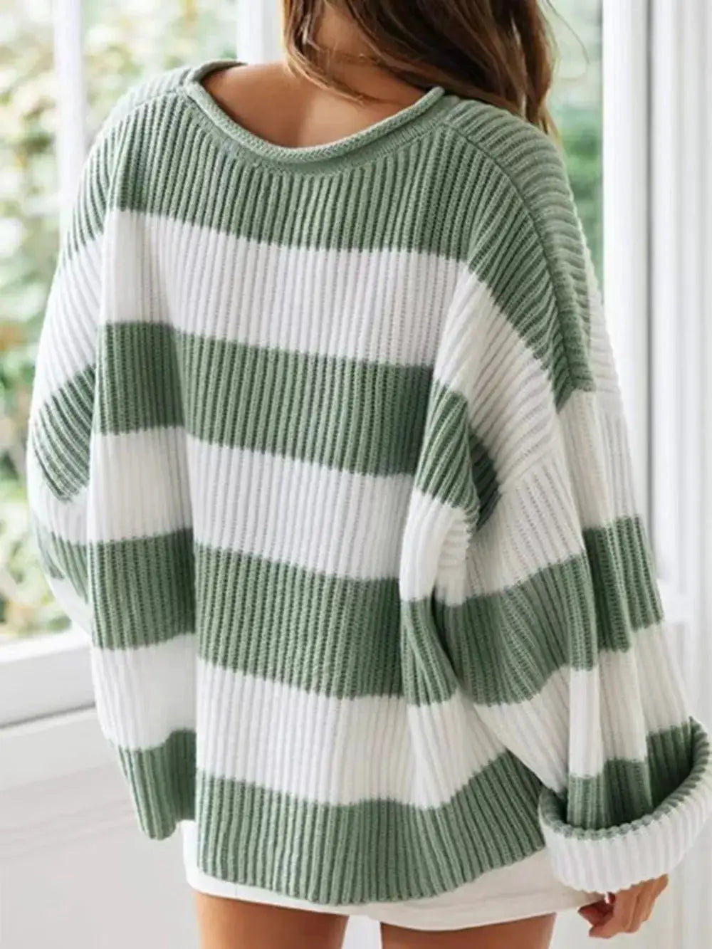 Essential striped knit sweater with round neck and long sleeves; sage green and white, relaxed oversized fit.