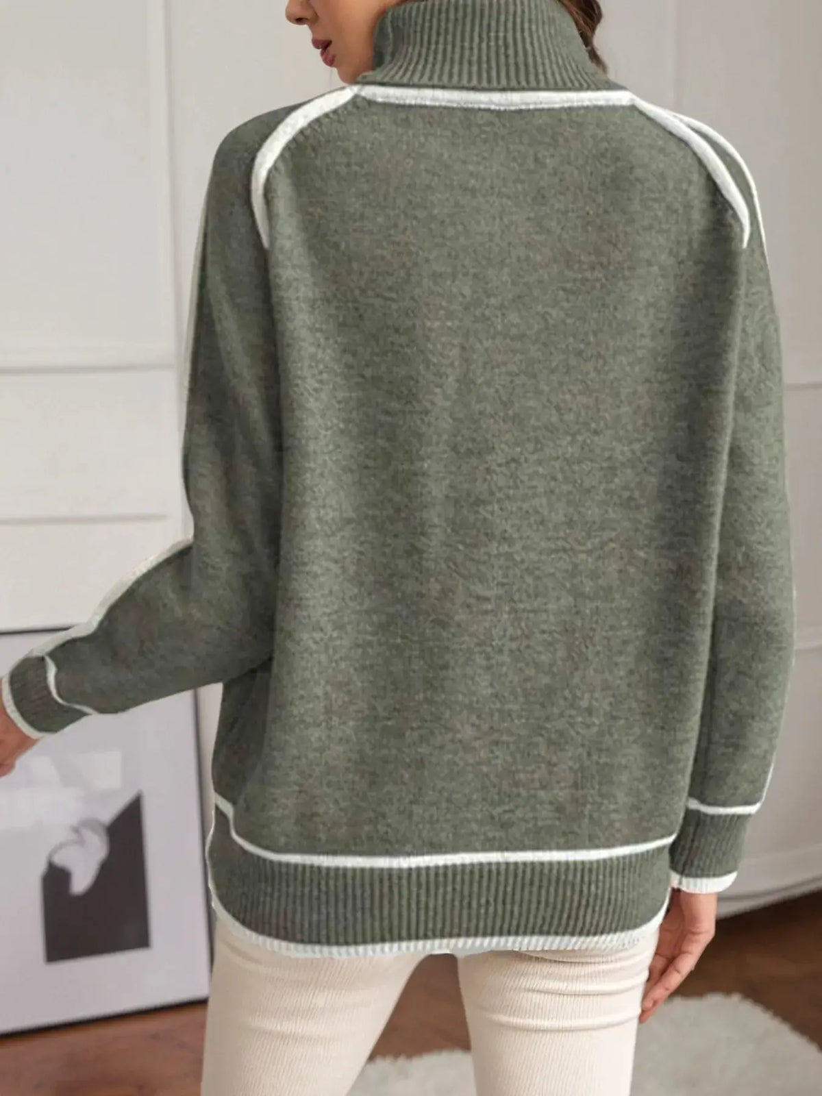 Trendsi olive green turtleneck sweater with white contrast trim along shoulders and hem; soft ribbed knit
