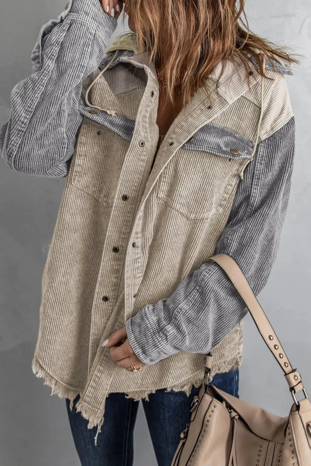 Snap Front Hooded Corduroy Shacket in beige with gray striped sleeves and frayed hem