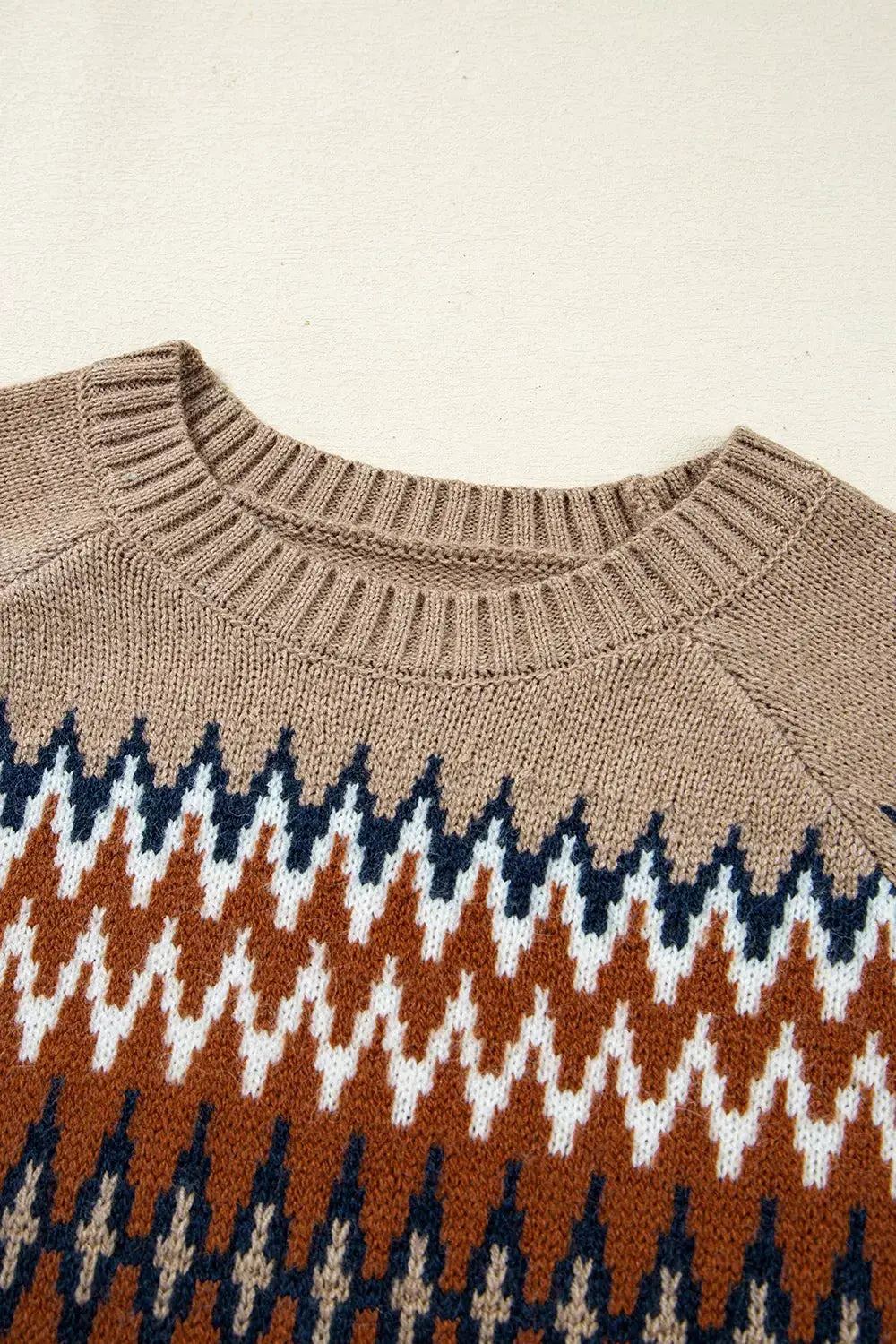 Geometric pattern long-sleeve knit sweater in beige with rust, navy and white zigzag motifs