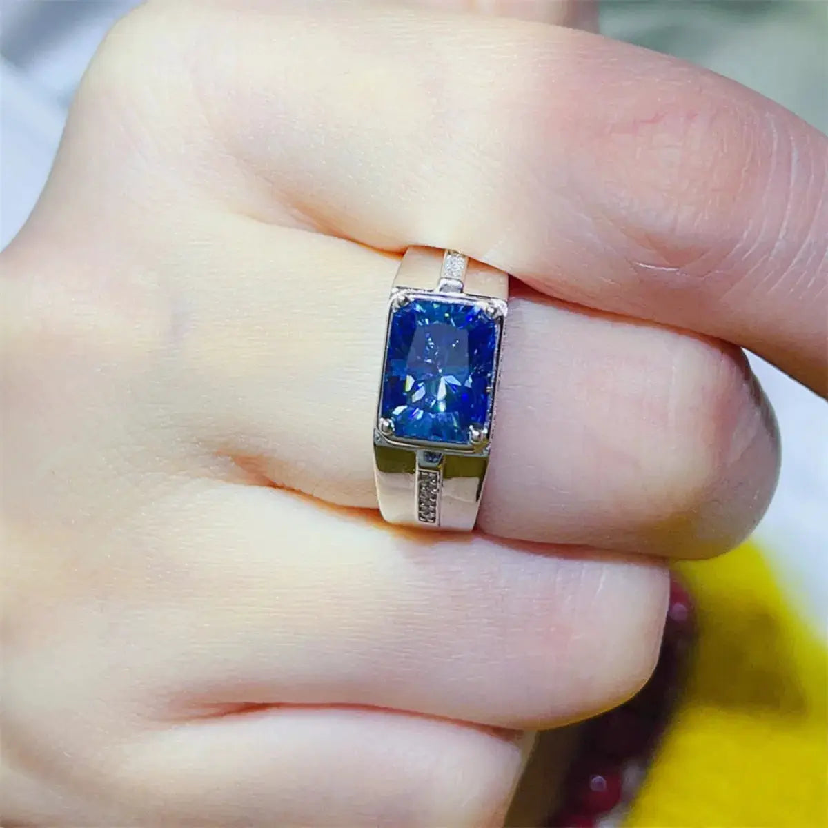 2 Carat Moissanite 925 Sterling Silver Ring with blue gemstone on finger