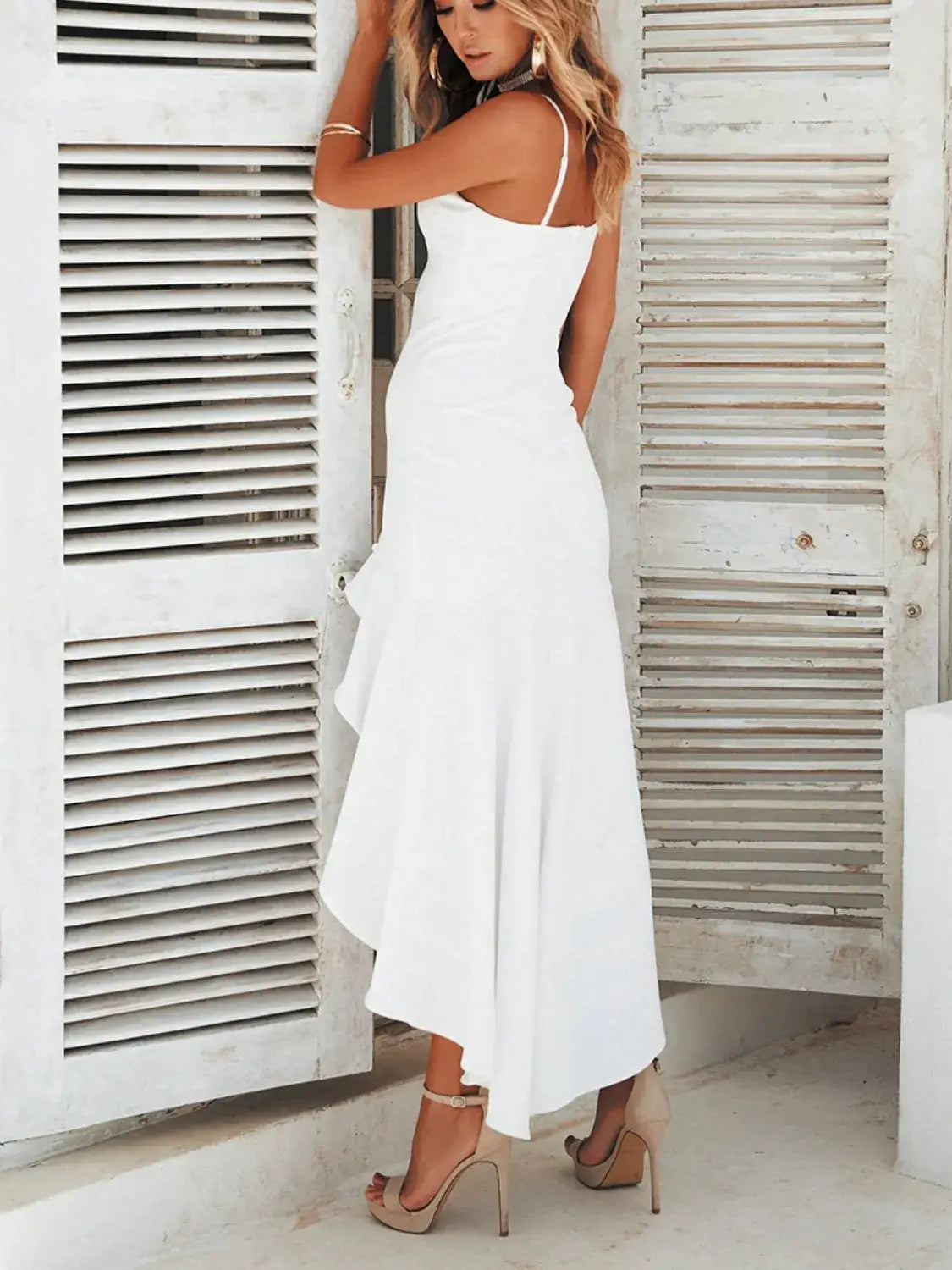High-Low Ruffled Hem Midi Cami Dress in white by Trendsi, back view with spaghetti straps.