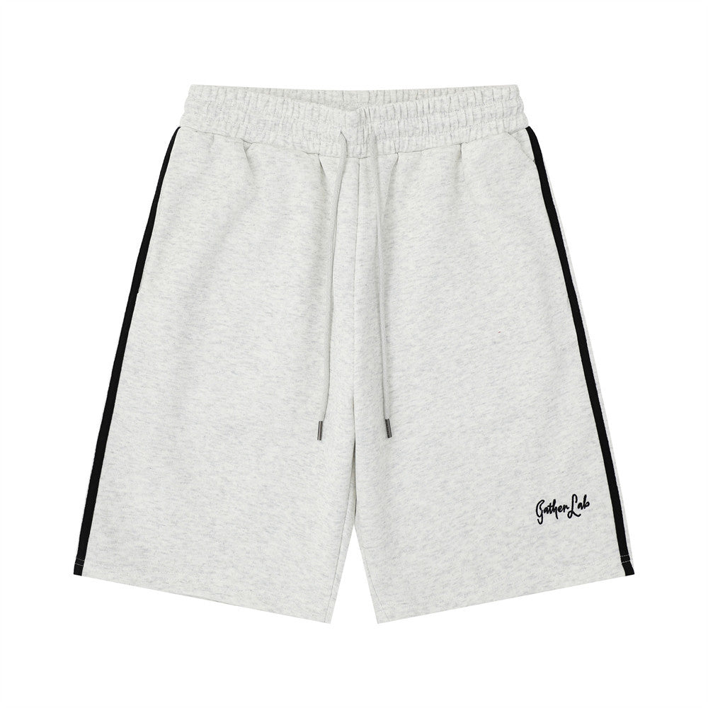 Hand drawn letter printed loose shorts in light gray with black side stripes and drawstring, Gather Lab logo