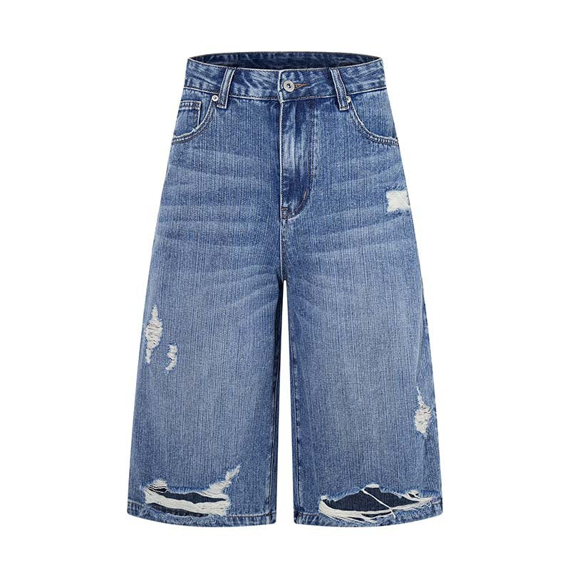 Denim shorts by eprolo, blue distressed with ripped hems, knee-length wide-leg