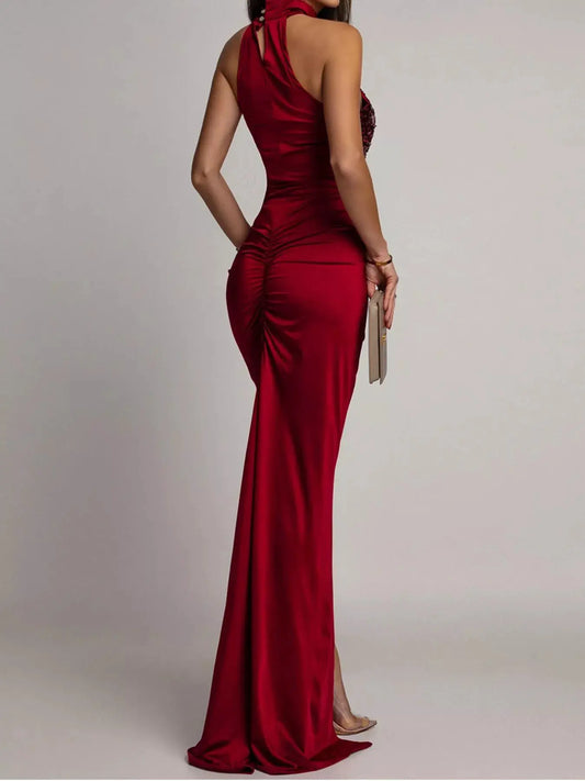 Sequin high-slit sleeveless red maxi dress by Trendsi, back view with beige clutch