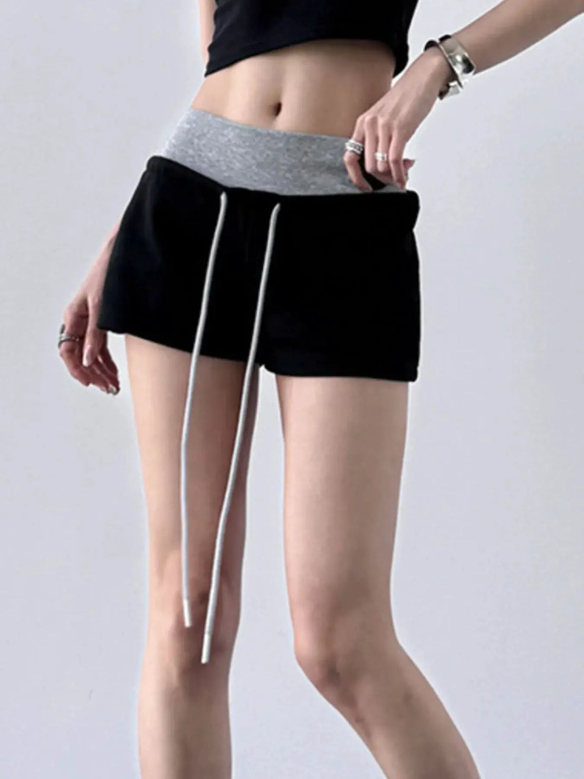 Drawstring shorts with contrast gray waistband, black body and white drawstrings